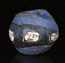 Roman mosaic glass blue bead with five ancient faces